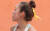 26일(현지시간) 인도네시아 팔렘방 자카바링 스포츠 시티 스포츠클라이밍센터에서 열린 2018 자카르타-팔렘방 아시안게임 여자 콤바인 결선 리드 경기에 출전한 김자인이 세월호 리본 머리핀을 하고 있다. [연합뉴스]