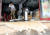 27일 오전 광주 남구 주월동의 한 식당이 한꺼번에 쏟아진 국지성 호우로 잠겨 업주가 물을 빼내고 있다. [연합뉴스]