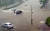 27일 광주·전남에 시간당 최고 62mm의 폭우가 쏟아지면서 광주 동구 서석동 조선대학교 교내 도로가 물에 잠겨 있다. [연합뉴스]