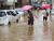 27일 오전 광주 남구 방림동 일대가 한꺼번에 쏟아진 국지성호우에 물에 잠겨 있다. [연합뉴스]