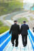 문재인 대통령(오른쪽)과 김정은 국무위원장이 공동 식수를 마친 후 군사분계선 표식물이 있는 ‘도보다리’까지 산책을 하며 담소를 나누고 있다. [청와대사진기자단]