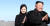 20일 백두산 정상인 장군봉에 오른 김정은 북한 국무위윈장(오른쪽)과 이설주 여사. 평양사진공동취재단 