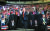 도널드 트럼프 미국 대통령이 9일(현지시간) 아이오와주 카운슬블러프스에서 열린 중간선거 지원유세 집회에 경호를 받으며 입장하고 있다. [AP=연합뉴스]