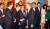 문재인 대통령(가운데)이 23일 청와대에서 열린 국무회의에 입장하며 참석자들과 인사를 나누고 있다. [청와대사진기자단]