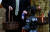 트럼프 대통령이 28일 백악관 핼러윈 행사에서 포장에 대통령 문양이 새겨진 사탕을 경찰 특공대 의상을 입은 어린이에게 주고 있다. [로이터=연합뉴스]