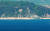 1일 오전 인천시 옹진군 연평도에서 바라본 북한 개머리해안의 포진지. 정면 육안으로 보이는 2개 포문 중 왼쪽 포문은 닫혀있지만 오른쪽 포문은 열려있다.[사진공동취재단]