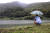 문재인 대통령이 지난 9월 29일 오전 비가 내리는 경남 양산시 사저 뒷산에서 산책하고 있다. [중앙포토]