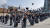 10일 다시세운광장에 모인 참가자들이 얼굴에 둘렀던 검은 천을 위로 던지고 있다. [사진 #미투 운동과 함께하는 시민행동]
