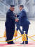 문재인 대통령과 김정은 국무위원장이 9월 18일 오전 평양 순안공항에서 열린 공식환영식에서 의장대 사열을 마친 뒤 서로 먼저 계단을 내려가라고 권유하고 있다. [평양사진공동취재단]