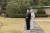  23일 아키히토 일왕의 85세 생일을 맞아 일본 왕실이 궁에서 생활하는 일왕 내외의 사진을 공개했다. 사진은 지난 10일 촬영된 것으로 아키히토 일왕이 미치코 왕비와 정원에서 무언가를 바라보고 있다. [AP=연합뉴스] 