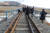 남북 철도 공동 조사단이 지난 15일 북한 동해선 나진 혼합궤 구간을 살펴보고 있다. [사진 통일부]