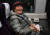 남북 동서해선 철도, 도로 연결 및 현대화 착공식에 참석하는 이산가족 김금옥 할머니가 26일 오전 판문역으로 가는 열차 안에서 환하게 웃고 있다.  사진공동취재단 
