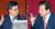 김동연 전 경제부총리(왼쪽)가 지난 10월 국회 대정부질문에서 청와대 업무추진비 사용 내용을 폭로한 심재철 자유한국당 의원의 질의에 답하고 있다. 변선구 기자