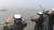 한국 해군 순항훈련전단 소속 충무공이순신함 탄 해군사관학교 생도들이 14일 오전 마지막 기항지인 중국 상하이의 우쑹(吳淞) 인민해방군 해군항 부두에 들어오면서 손을 흔들고 있다. [해군 제공]