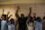 두짓 호텔 인근의 사무실 근무자들이 경찰에 의해 소개되기 전 두 손을 들고 대기하고 있다. [AFP=연합뉴스]