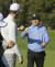 8일 열린 PGA 투어 AT&T 페블비치 프로암 1라운드에서 애런 로저스와 손을 부딪히는 최호성. [AP=연합뉴스]