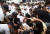 경찰이 지난 2011년 8월 12일 오후 국회의사당 본청 앞에서 &#34;반값등록금 실현&#34;을 요구하며 항의 시위를 벌이는 대학생들을 연행하고 있다. [중앙포토]
