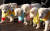 지난해 12월 25일 풍산개 곰이의 새끼 강아지들이 서광지역아동센터 어린이들이 선물한 손뜨개 목도리를 두르고 관저 마당을 뛰어다니고 있다. [사진 청와대]