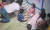경북 구미의 한 어린이집 CCTV에 보육교사가 아이를 책으로 때리는 장면이 찍혔다. 사진 속 아이가 자신의 뺨을 쓰다듬고 있다. [사진 피해 아동 부모]