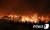 지난 4일 오후 7시 17분쯤 강원 고성군 토성면 원암리의 한 주유소 인근 야산에서 발생한 산불. [뉴스1] 