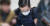 SK그룹 창업주 손자인 최모씨가 지난 1일 오후 인천시 미추홀구 인천지방경찰청 광역수사대로 들어서고 있다. [뉴스1]