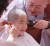한 동자승이 단기출가 삭발 수계식이 열린 22일 서울 종로구 조계사에서 스님이 머리를 깎자 밝게 미소 짓고 있다.     임현동 기자