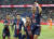 PSG 공격수 킬리안 음바페(오른쪽 위)가 22일 열린 AS모나코와의 프랑스 리그1 홈 경기에서 해트트릭을 작성하고 동료들과 함께 기뻐하고 있다. PSG 선수들의 유니폼 전면에는 노트르담 성당의 모습이 새겨져 있다. [AP=연합뉴스]