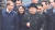 24일 러시아 블라디보스토크에 도착한 김정은 북한 국무위원장이 알렉산드르 코즐로프 극동·북극개발 장관의 영접을 받으며 역사를 빠져나오고 있다. [AFP=연합뉴스]