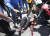 30일 장갑차에 깔려 부상당한 시위대를 동료 시민들이 병원으로 후송하고 있다.[로이터=연합뉴스]