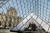 에어비앤비 이벤트에 당첨된 다니엘라와 아담이 지난달 30일(현지시간) 프랑스 파리 루브르 박물관 유리 피라미드 안에 마련된 침실에 앉아 있다. [로이터=연합뉴스] 