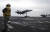 지난 2월 포착된 USS 에이브러햄 링컨 항모전단 소속 전투기와 군인 모습. [AP]