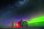 남극점에 위치한 미국의 아문젠 스콧기지의 아이스큐브 연구소 야경. 남극 밤하늘에 오로라가 펼쳐져 있다. [로이터=연합뉴스] 