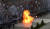 11일(현지시간) 반정부 시위대가 던진 휘발유 폭탄이 경찰들이 도열해 있는 저지선 한 가운데에서 폭발해 화염이 치솟고 있다. [AP=연합뉴스]