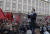 11일(현지시간) 청사앞에 모인 반정부 시위대를 향해 룰짐 바샤 민주당 대표가 발언을 하고 있다. [EPA=연합뉴스]