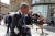 나이절 패라지 영국 브렉시트당 대표가 20일(현지시간) 뉴캐슬 시내에서 유세 도중 폴 크라우더가 던진 밀크셰이크를 맞고 이동하고 있다. [로이터=연합뉴스] 