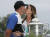 지난 5월 열린 PGA 챔피언십에서 2연속 우승 후 브룩스 켑카가 여자친구와 키스하고 있다. [AP]