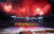  6월 20일 저녁 시진핑 중국 국가주석을 환영하는 집단체조와 예술공연이 평양 5.1경기장에서 열렸다. 북한과 중국 두 나라의 우의를 표햔한 문구 위에 두 나라의 국기와 친선 70년이라는 글씨가 보인다. [신화통신=연합뉴스]