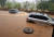 장마전선의 영향으로 남부지방에 많은 비가 내린 지난해 7월 1일 전남 보성군 보성읍의 한 도로가 침수돼 차량들이 거북이 운행을 하고 있다. 장마철 폭우 피해 예방을 위해 예측 능력 향상이 필요하다. [독자 제공=연합뉴스] 