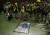 시위대가 앤드루 렁 입법회 의장의 초상을 바닥해 던져 훼손한 뒤 사진을 찍고 있다. [EPA]