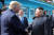 도널드 트럼프 미국 대통령과 김정은 북한 국무위원장이 지난달 30일 오후 판문점에서 악수하고 있다. 문재인 대통령이 이를 바라보고 있다. [연합뉴스]