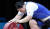 장미란이 2012년 런던 올림픽 여자 역도 최중량급(75㎏ 이상) 용상 3차시기에서 실패한 뒤 역기에 손을 올리는 &#39;작별 의식&#39;을 하고 있다. 장미란은 런던올림픽을 마지막으로 현역에서 은퇴했다. [연합뉴스]