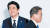 문재인 대통령이 28일 일본 오사카에서 열린 G20 정상회의 환영식에서 아베 신조 일본 총리와 인사를 나눈 뒤 이동하고 있다. [AP=연합뉴스]