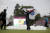 고진영이 29일 열린 LPGA 투어 에비앙 챔피언십에서 우승한 뒤, 스카이다이버가 전달한 태극기를 들고 기뻐하고 있다. [AP=연합뉴스]