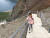 24일 한 소녀가 백두산 천지로 향하는 계단을 힘겹게 오르고 있다. [타스=연합뉴스]