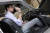 소더비 직원이 무려 50년 전 &#39;본드카&#39; 차량 안에 숨겨진 전화기를 보여주고 있다. [AP=연합뉴스]