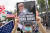 11일 홍콩 빅토리아 공원에서 진행된 송환법 반대시위에서 한 참가자가 도널드 트럼프 미국 대통령의 사진을 들고 있다. [EPA=연합뉴스]