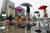 12일 오전 서울 종로구 광화문네거리에서 우산을 쓴 시민들이 출근길 발걸음을 재촉하고 있다. 기상청은 이날 제9호 태풍 &#39;레끼마&#39;의 영향으로 전국이 대체로 흐리고 서울·경기와 강원 영서 북부 등에는 비가 오겠다고 밝혔다. [뉴스1]