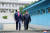도널드 트럼프(왼쪽) 미국 대통령과 김정은 북한 국무위원장이 지난 6월 30일 오후 판문점에서 군사분계선을 넘고 있다. [연합뉴스]