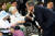 지난해 8월 14일 오후 충남 천안 국립 망향의 동산 안 모란묘역에서 열린 &#39;일본군 위안부 피해자 기림의 날&#39; 첫 정부 기념식에서 김경애 할머니가 문재인 대통령의 볼을 만지고 있다. 청와대 사진기자단