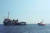지중해를 항해하는 난민구조선 시워치 3호(왼쪽)을 이탈리아 경비선이 감시하고 있다. [AP=연합뉴스} 